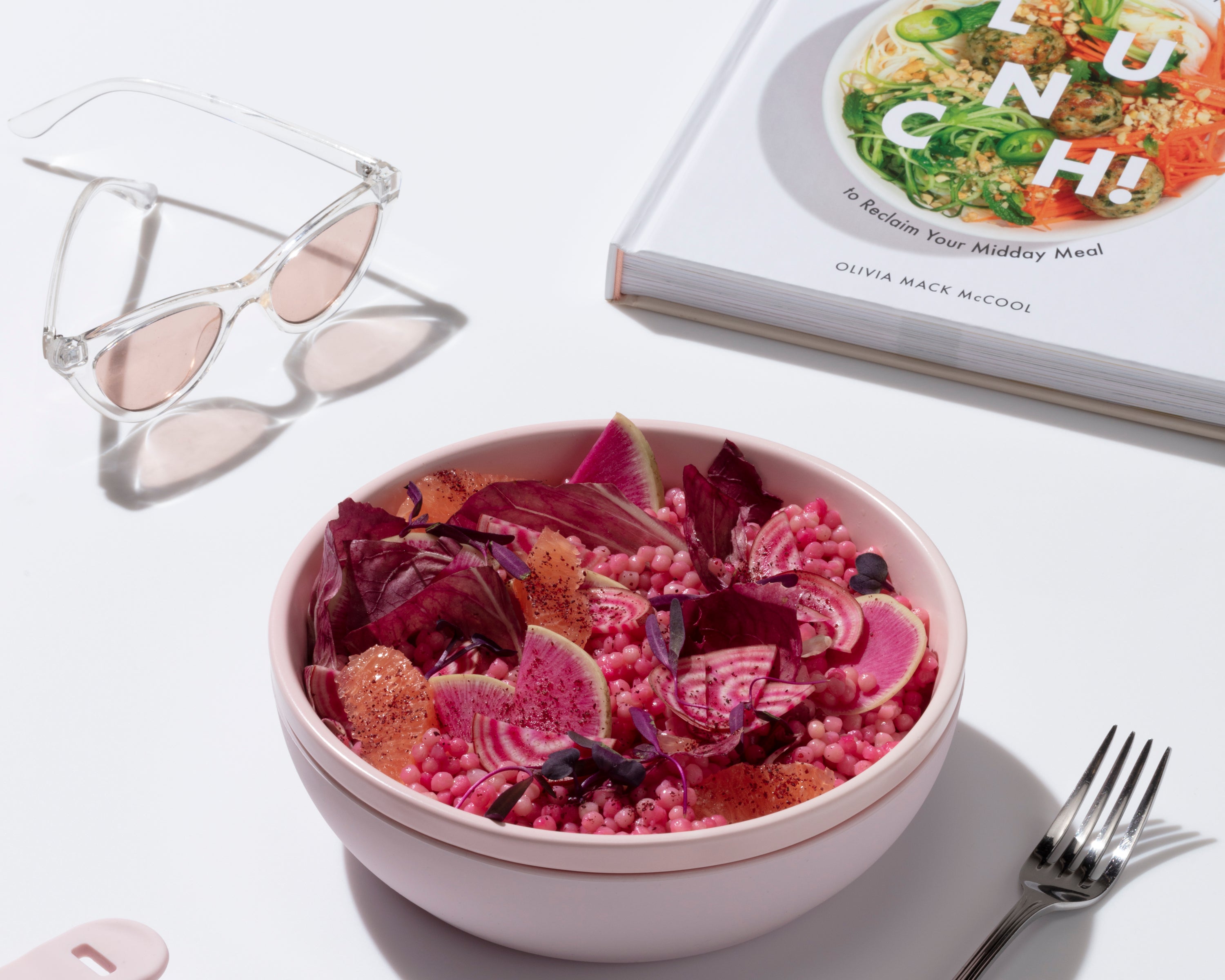 W&P Lunch Cookbook beside a pink bowl of beet salad and a fork