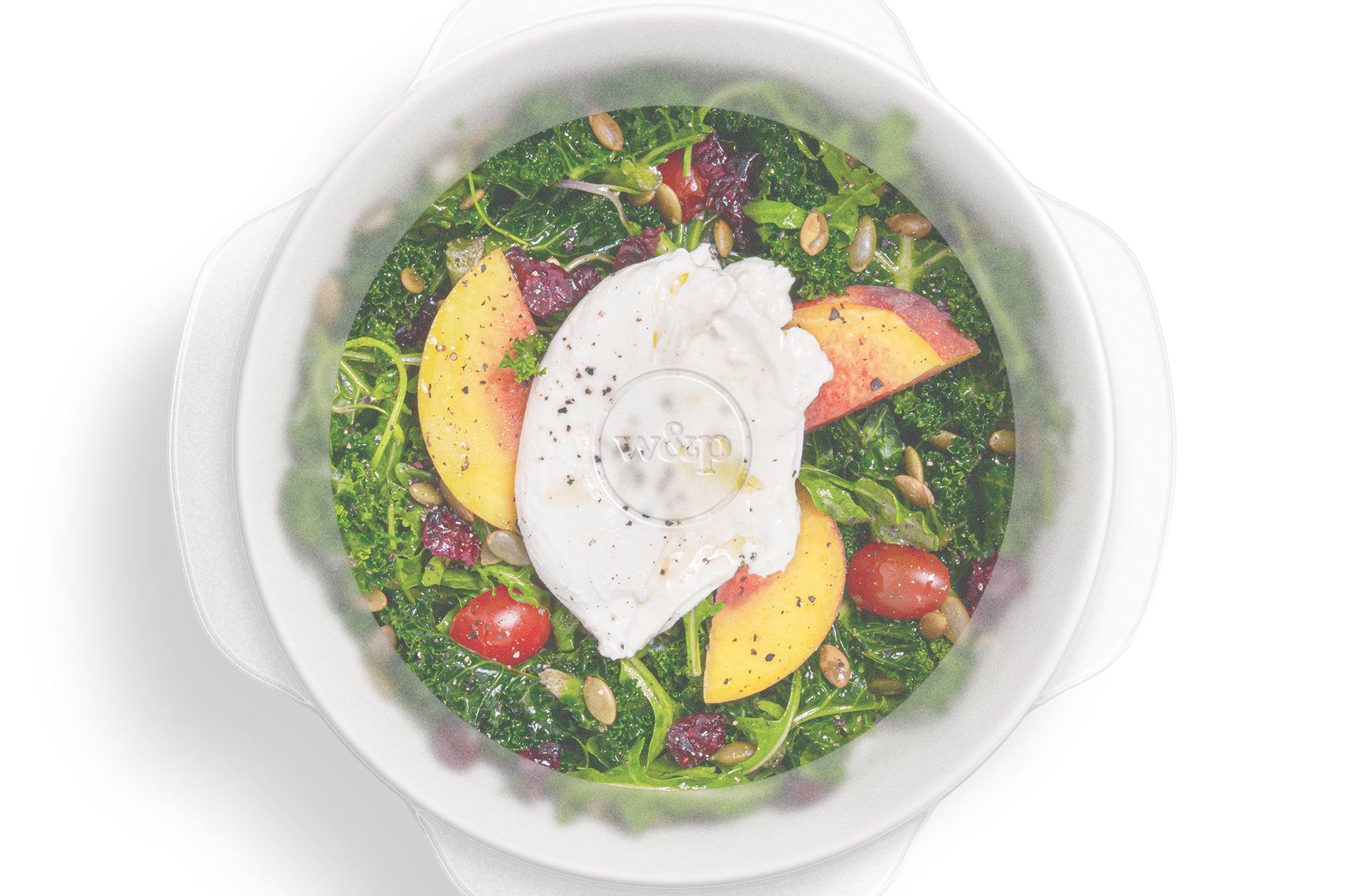 W&P Reusable Stretch Lid covering a bowl of salad with poached egg, from above