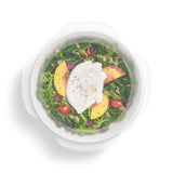 W&P Reusable Stretch Lid covering a bowl of salad with poached egg, from above