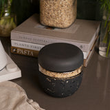 W&P Seal Tight Bowl in Terrazzo Charcoal filled with granola on a kitchen counter beside cookbooks