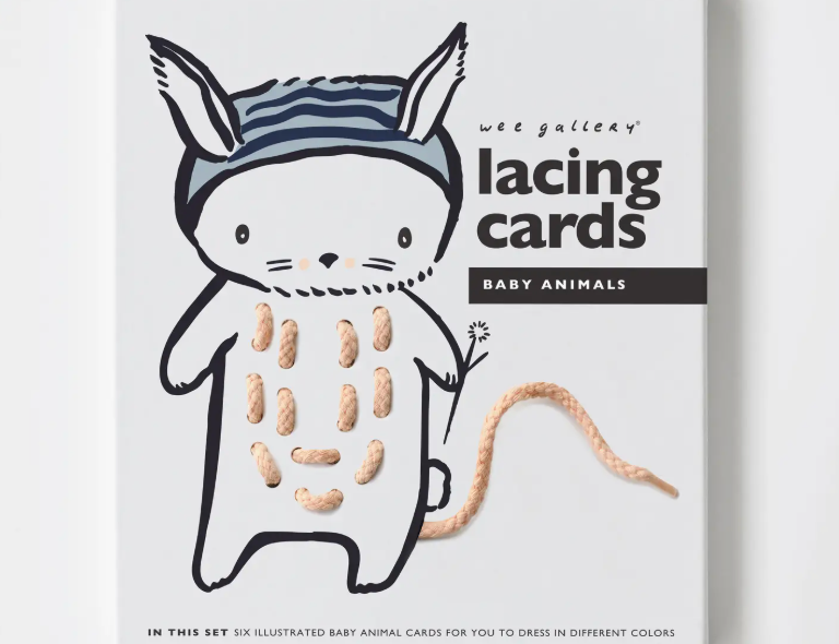 Wee Gallery Animal Lacing Cards in Baby Animals, boxed set showing a bunny card with a peach lacing cord