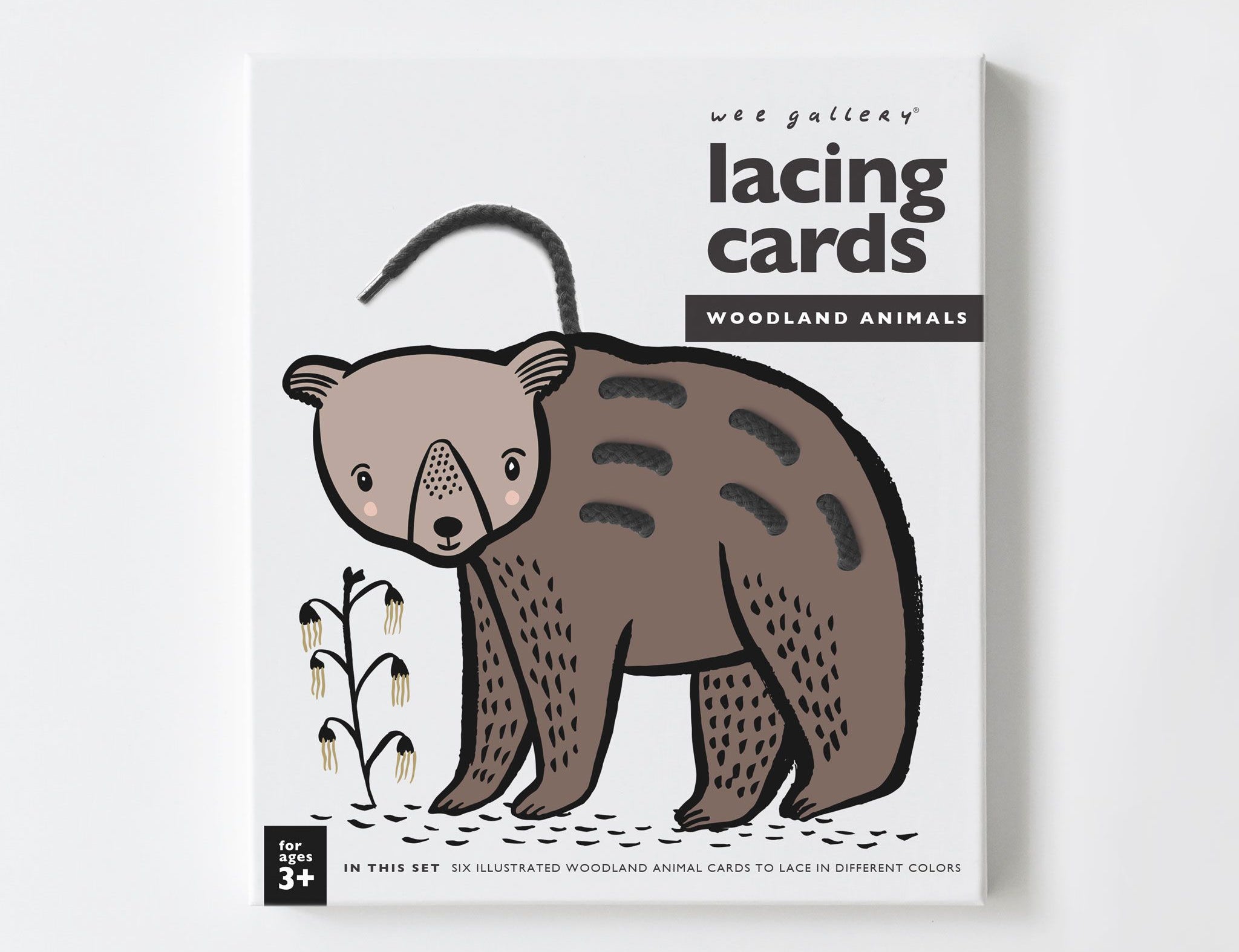 Wee Gallery Animal Lacing Cards in Woodland Animals, boxed set showing a brown bear card