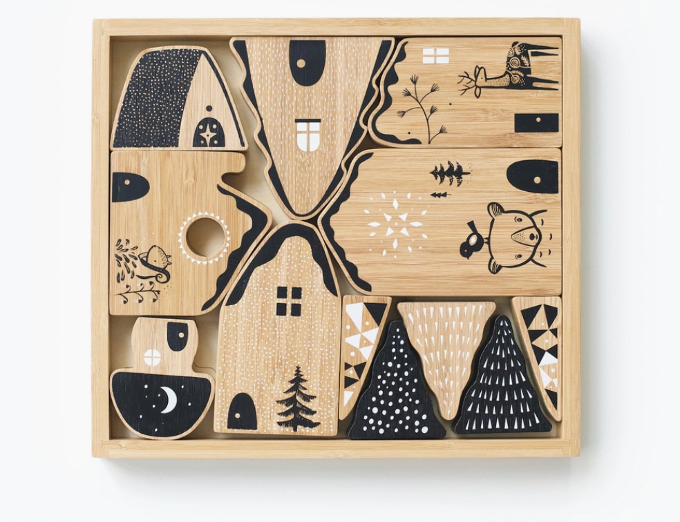 Wee Gallery Woodland Village, a wooden puzzle tray of house-shaped blocks with black and white animal prints