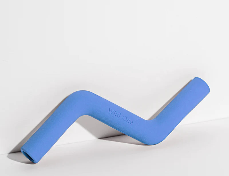 Wild One Bolt Bite Dog Toy in Moonstone blue, a zigzag rubber chew toy lying on its side