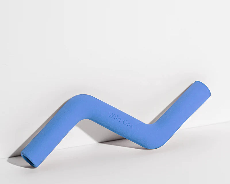 Wild One Bolt Bite Dog Toy in Moonstone blue, a zigzag rubber chew toy lying on its side