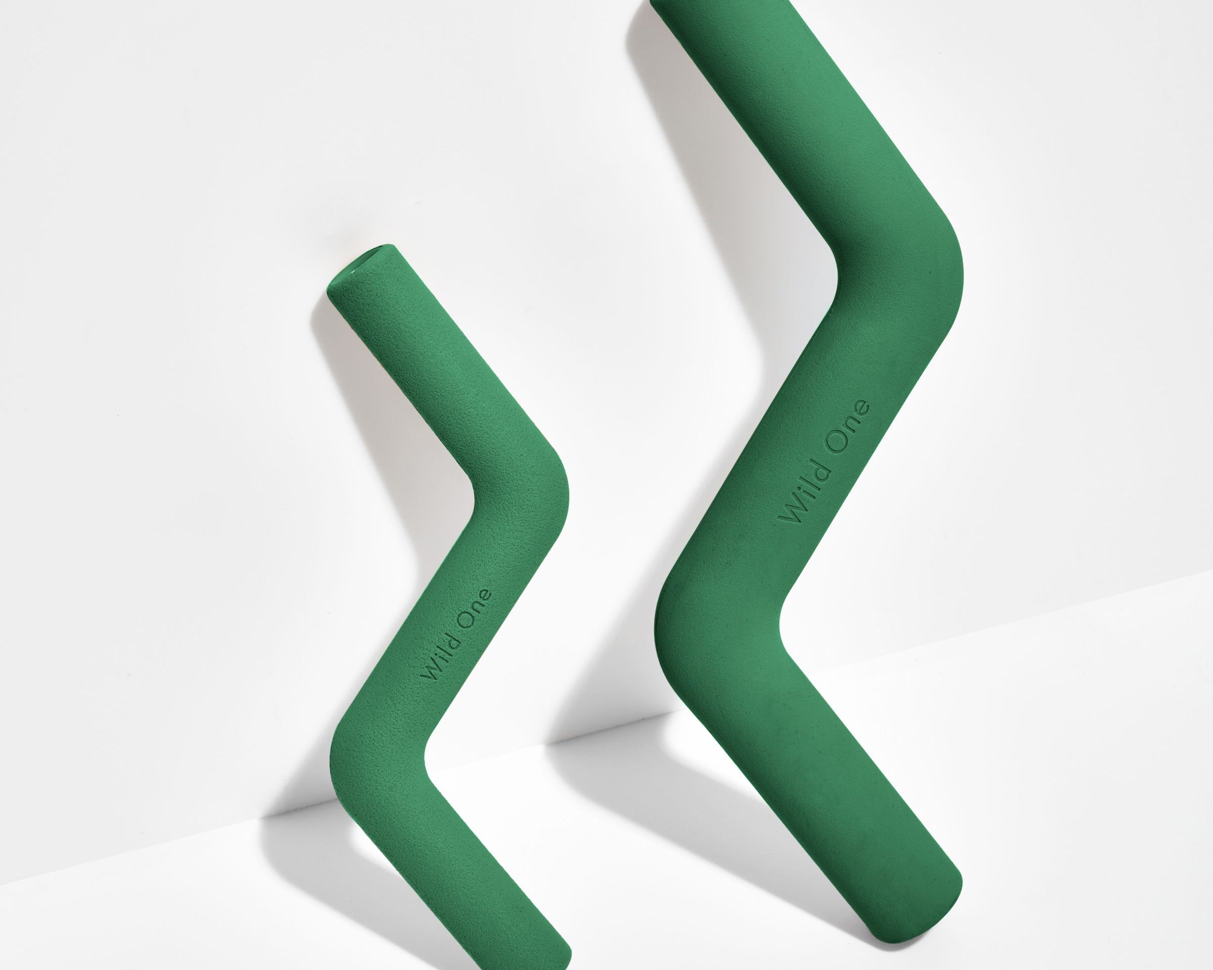 Wild One Bolt Bite Dog Toy in Spruce green shown in small and standard sizes side by side