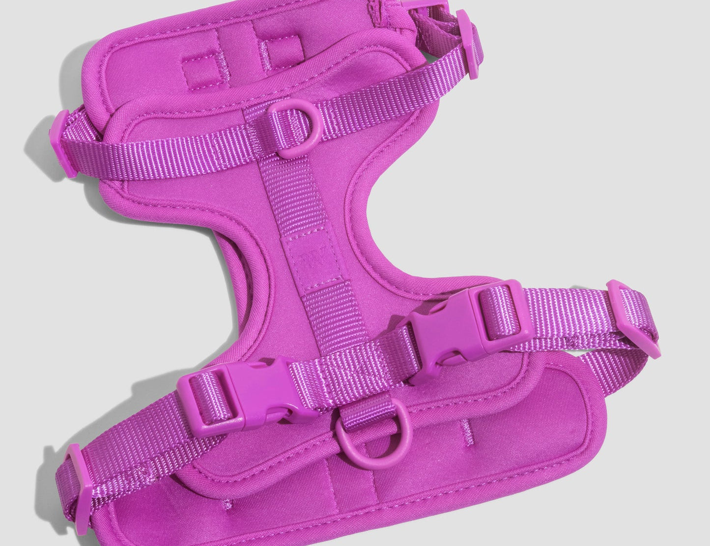 Wild One Dog Harness in Orchid, a magenta padded adjustable harness, laid flat