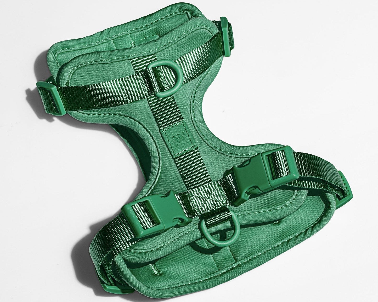 Wild One Dog Harness in Spruce green, a padded adjustable harness with matte buckles, laid flat