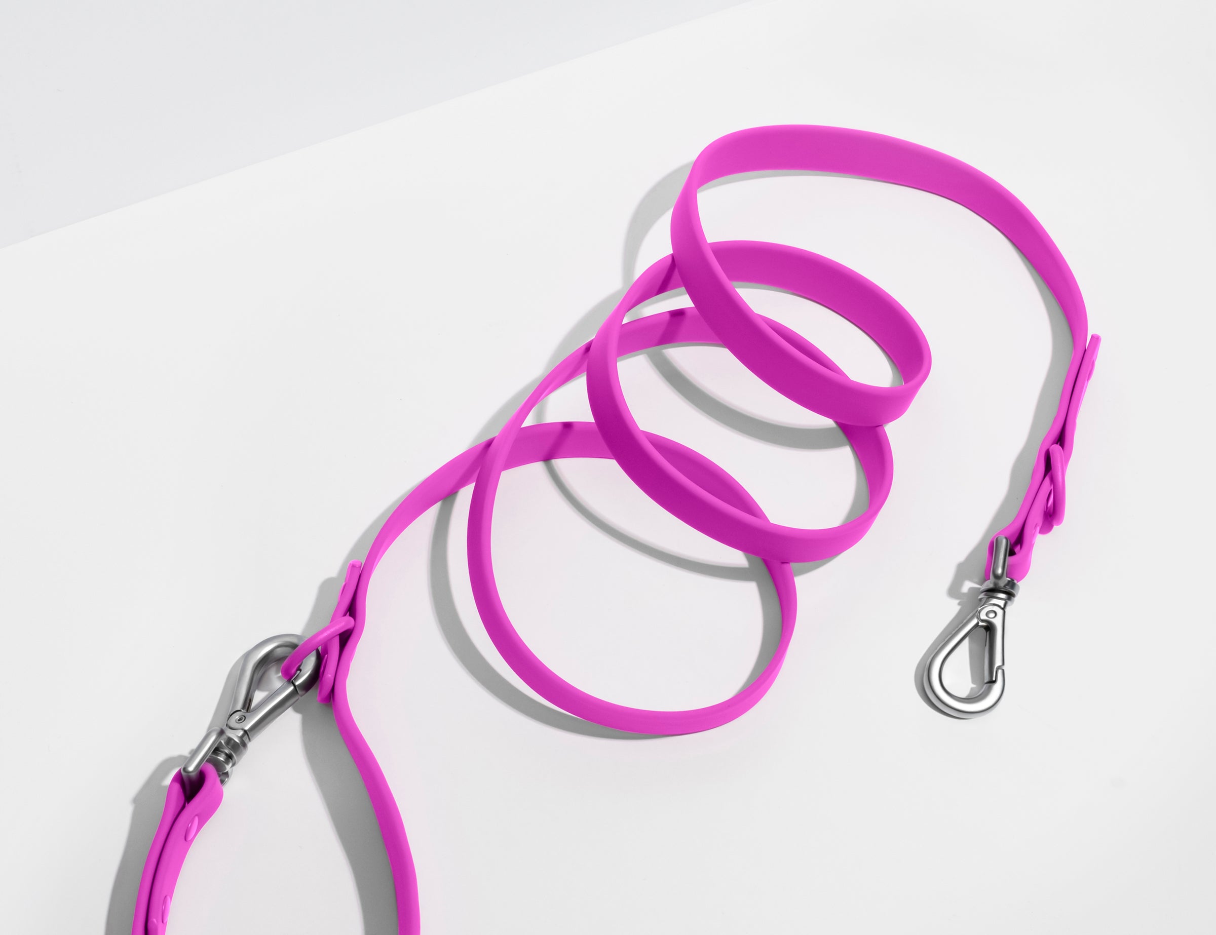 Wild One Dog Leash, eleventh view, orchid pink leash coiled on a white background