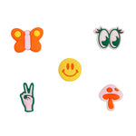 Wild One Groovy Small Flair Charms: an orange butterfly, green eyes, yellow smiley, peace sign and pink mushroom