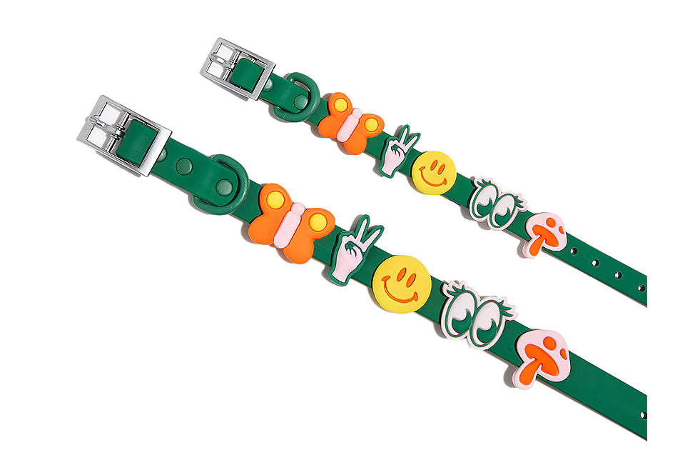 Two green Wild One collars decorated with all five Groovy Flair Charms