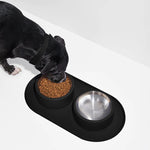Wild One Placemat for Dogs, fourth view, a black dog eating from bowls on the black placemat