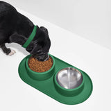 Wild One Placemat for Dogs, sixth view, a black dog eating from bowls on the spruce placemat