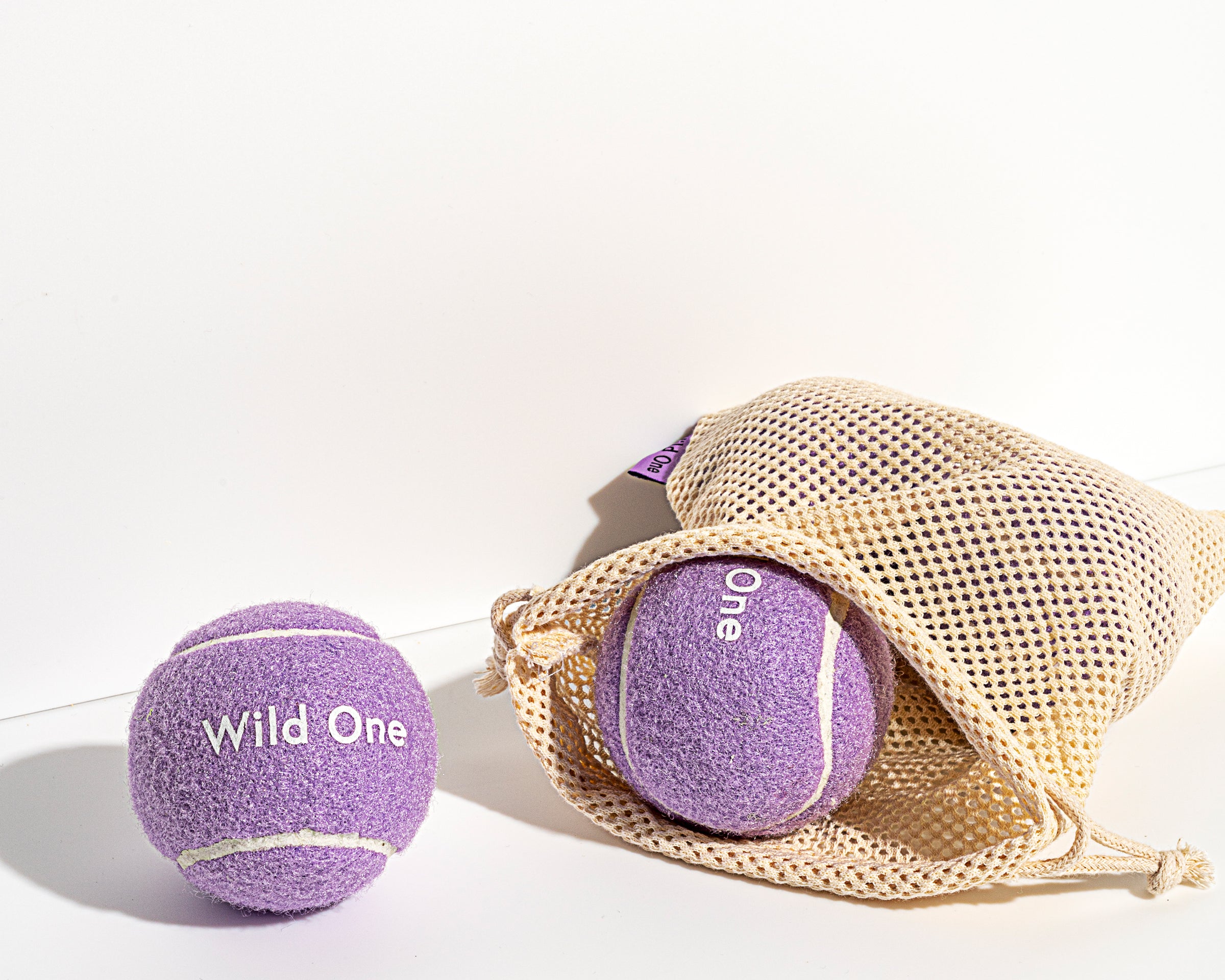 Wild One Tennis Balls in Lilac with a mesh carry bag