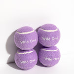 Wild One Tennis Balls in Lilac, four purple felt balls stacked with the Wild One logo