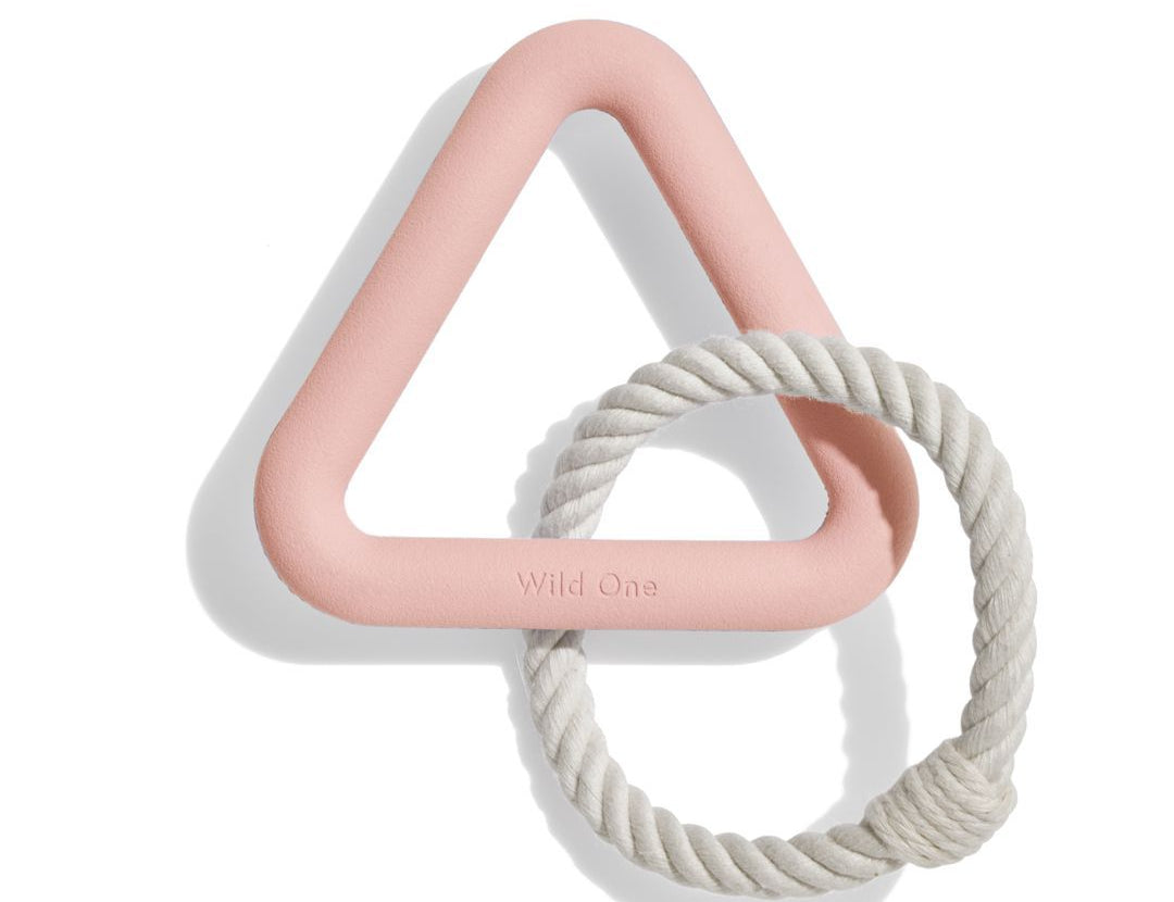 Wild One Triangle Tug Toy in Blush, a pink rubber triangle with a cream rope loop