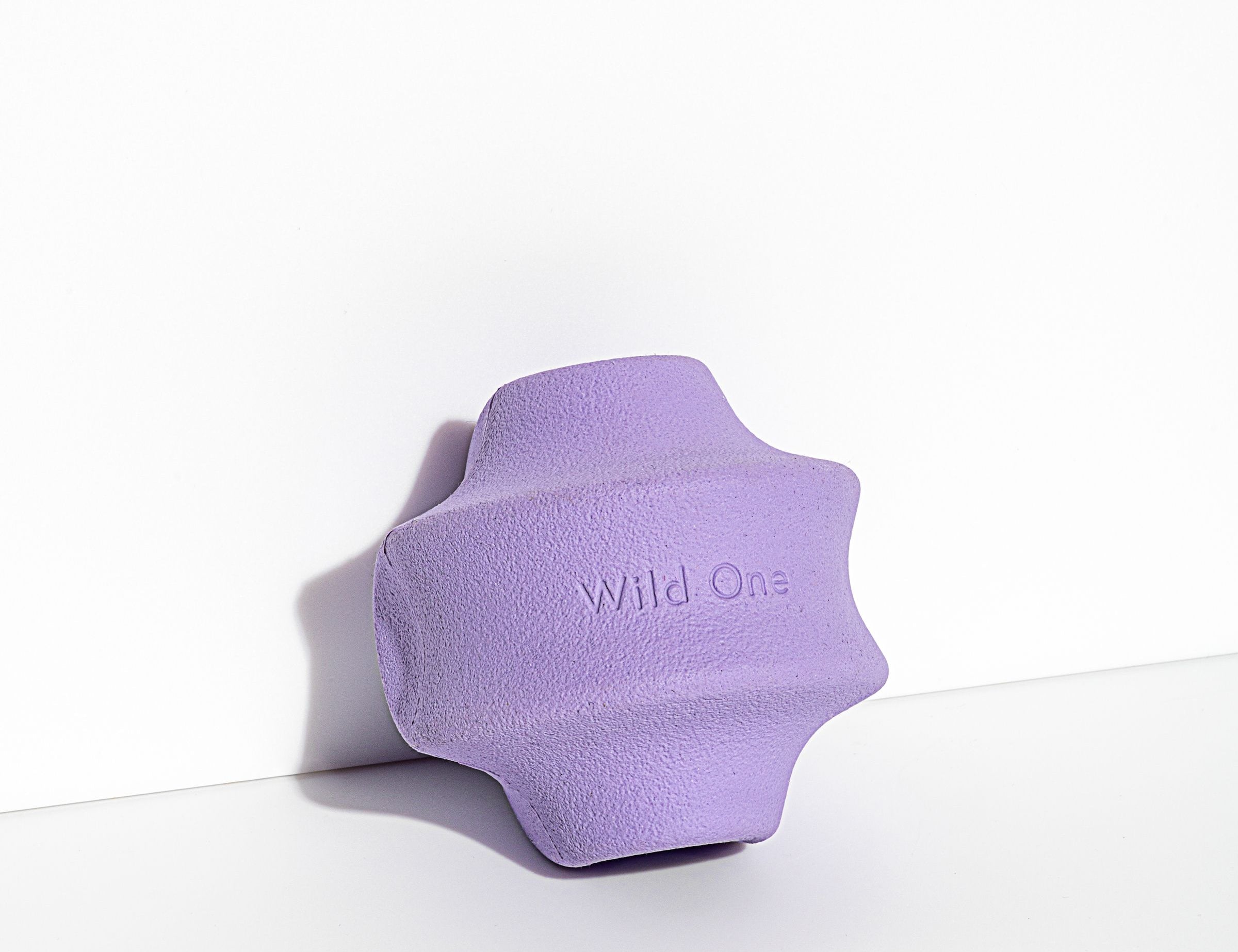 Wild One Twist Toss Dog Toy in Lilac, a purple rubber twisted treat toy