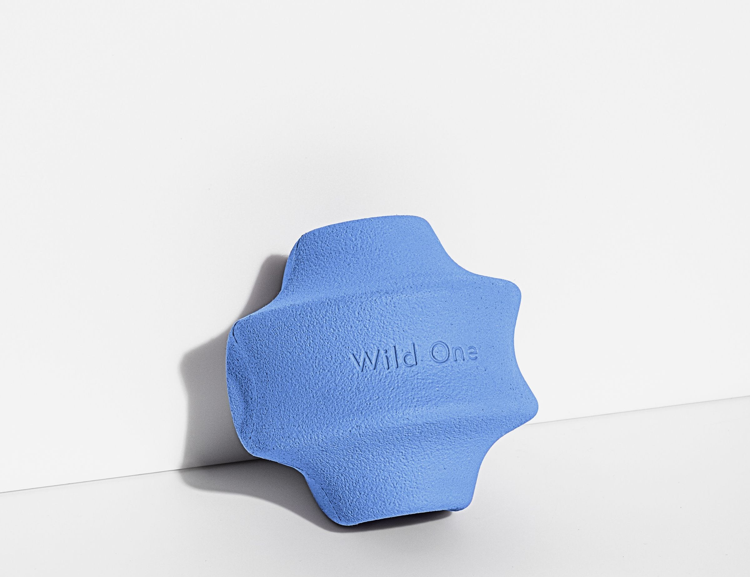 Wild One Twist Toss Dog Toy in Moonstone, a blue rubber twisted treat toy