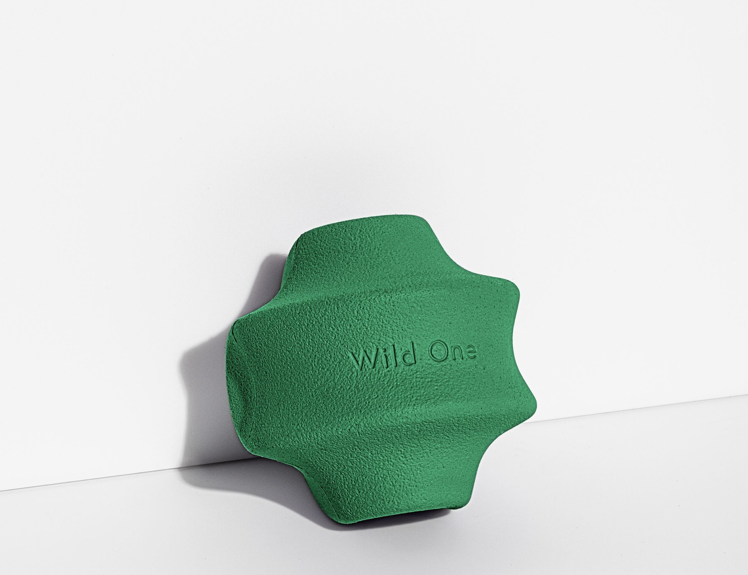 Wild One Twist Toss Dog Toy in Spruce, a green rubber twisted treat toy